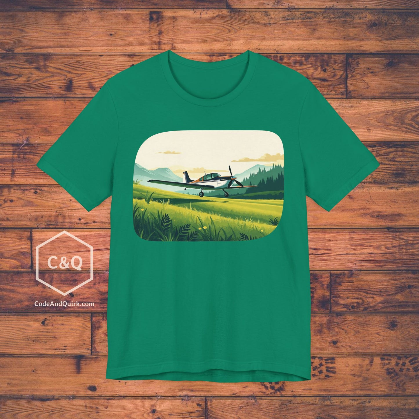 Small plane landing on grass amidst mountains - aviation fan's T-Shirt