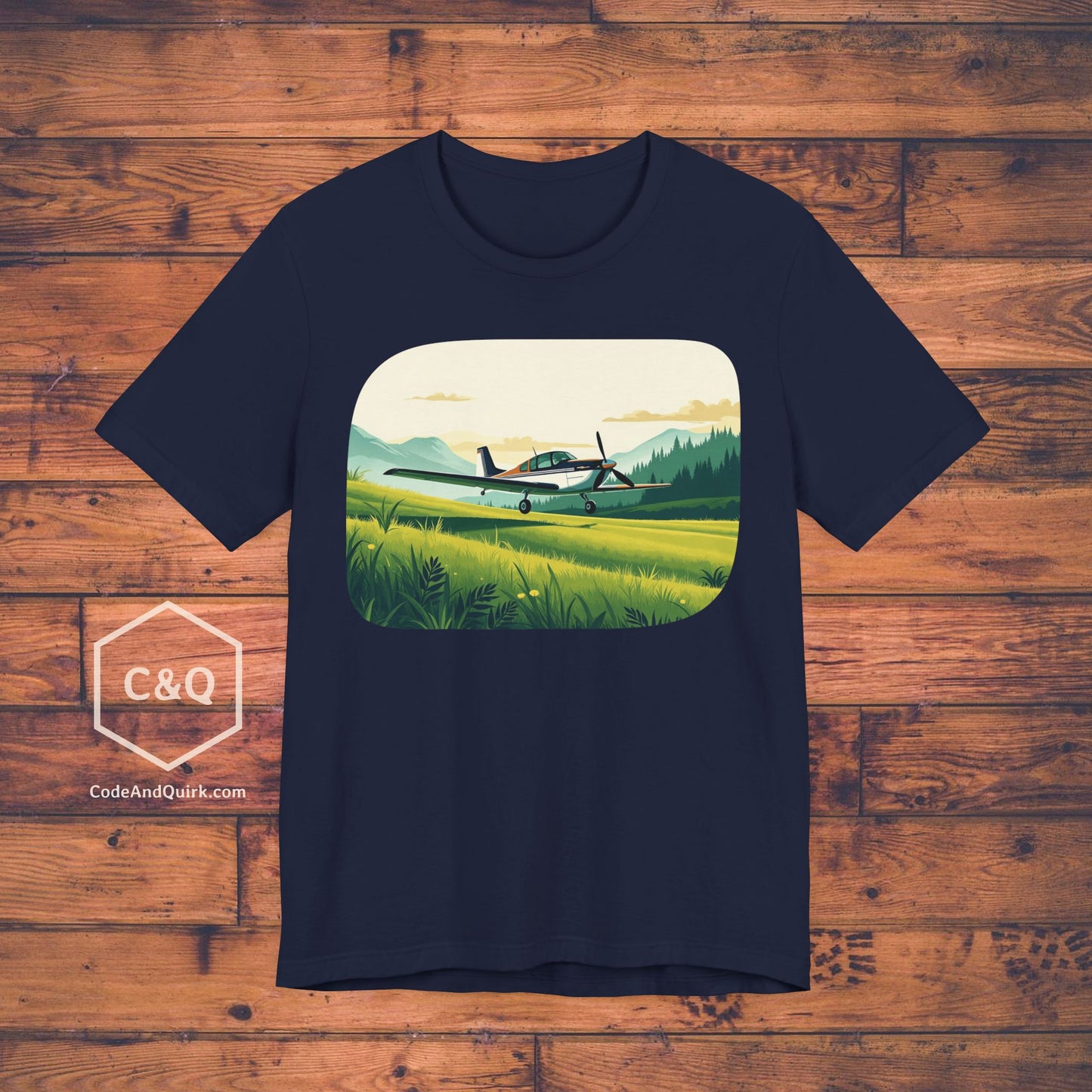 Small plane landing on grass amidst mountains - aviation fan's T-Shirt